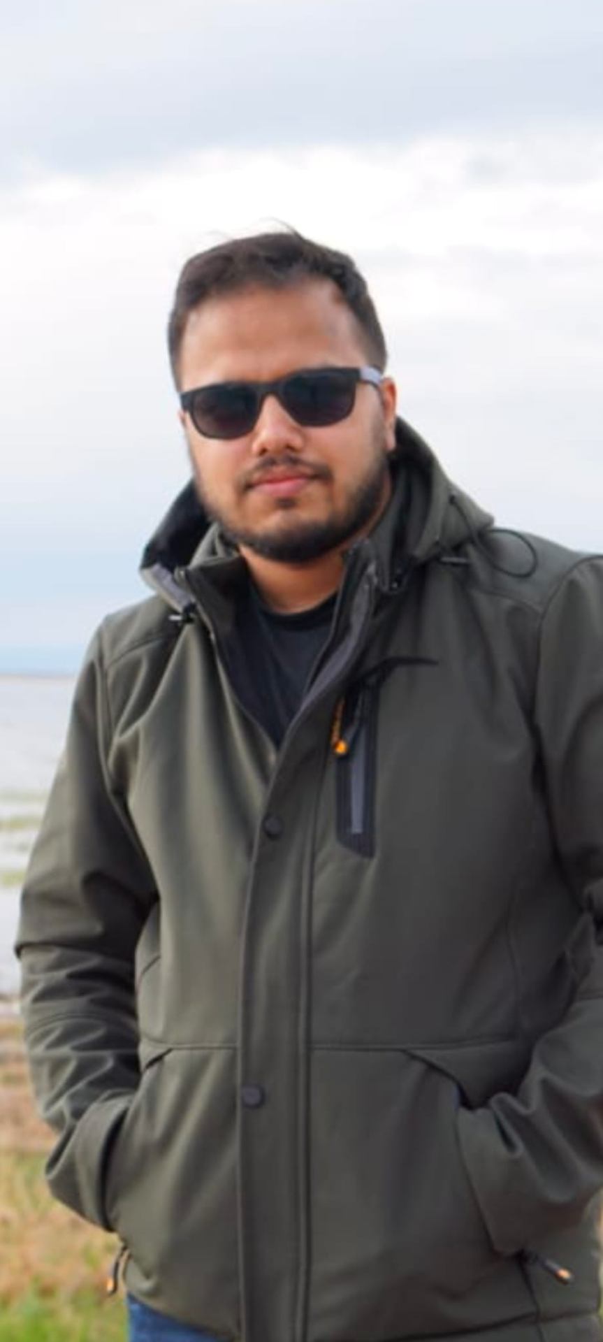 Dr. Md Al Araf Hussain outdoors by the sea